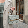 Tory Burch Queen Anne Lace floral leather top handle handbag with cream botanical print and golden hardware, styled for afternoon tea, garden parties, and elegant daytime occasions.