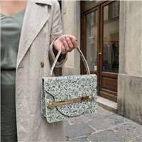 Tory Burch Queen Anne Lace floral leather top handle handbag with cream botanical print and golden hardware, styled for afternoon tea, garden parties, and elegant daytime occasions.