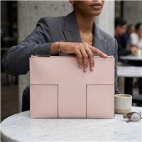Tory Burch large blush pink leather travel document clutch pouch with stitched Block T front detailing, gold foil signature logo and top zipper closure.