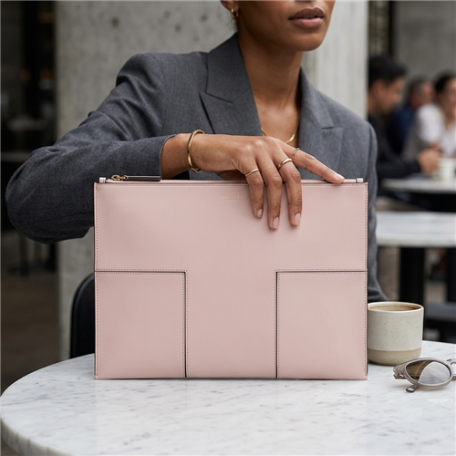 Tory Burch large blush pink leather travel document clutch pouch with stitched Block T front detailing, gold foil signature logo and top zipper closure.