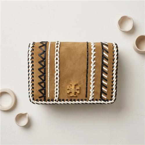 Tory Burch Kira Whipstitch mini crossbody bag in hazel brown suede with black and white stitched detailing, gold tone logo hardware, and removable chain accented shoulder strap.