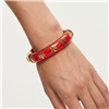 Tory Burch Kira glossy red resin bangle bracelet with repeating gold tone T logo charms, gold hardware, 2.25 inch diameter, and 0.5 inch width.
