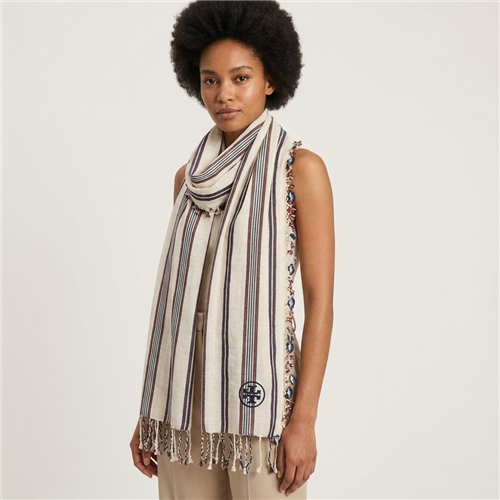 Tory Burch Cream Multi 27 x 72 inch striped blanket scarf with cream background, navy and burgundy vertical stripes, floral inspired side trim, twisted fringe, and Tory Burch logo detail.