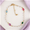 Zad Jewelry Ocean Treasure gold tone anklet featuring white pearl inspired beads and faceted aqua blue, emerald green, pink, and fuchsia jewel accents with adjustable extender chain.