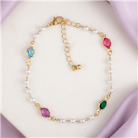 Zad Jewelry Ocean Treasure gold tone anklet featuring white pearl inspired beads and faceted aqua blue, emerald green, pink, and fuchsia jewel accents with adjustable extender chain.