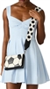 Betsey Johnson Kickin It wallet crossbody featuring a black and white soccer ball design, compact structured silhouette, zipper detail, and wide adjustable soccer ball print strap.