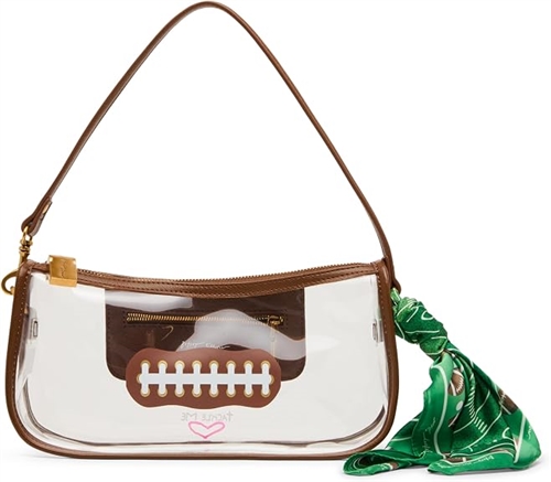 Betsey Johnson Miss Touchdown clear football shoulder bag featuring brown trim, football lace detail, structured transparent body, brown shoulder handle, and green printed scarf accent.