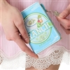 Betsey Johnson Dip It folding wallet designed like a light blue ranch dressing package with green graphics, illustrated vegetables, creamy dip artwork, and retro food label details.
