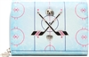 Betsey Johnson Puckin Around light blue ice hockey wallet crossbody featuring rink graphics, crossed hockey sticks, puck details, novelty hockey charms, and a removable strap.