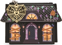 Betsey Johnson Boo and Breakfast black haunted house bifold wallet featuring glowing orange windows, boarded window graphics, purple and green roof details, spiderweb accents, and a gold tone spiderweb zipper charm.