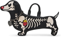 Betsey Johnson Weenie and the Beast black and white novelty crossbody handbag shaped like a dachshund with skeleton bone graphics, dimensional dog details, and long black strap.