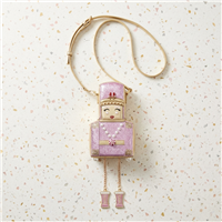 Betsey Johnson pink rhinestone Nutcracker novelty crossbody handbag with gold tone trim, faux pearl accents, peppermint detail and dangling chain legs with pink boots.