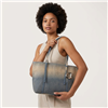 Betsey Johnson Slouchy Denim Tote Bag featuring blue and neutral ombre coloring, long shoulder handles, silver tone hardware, and a dimensional handbag charm.