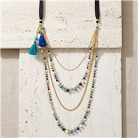 Nakamol multilayer gold tone statement necklace with cascading chains, turquoise, blue and green agate and glass beads, leather details and colorful tassel accents.