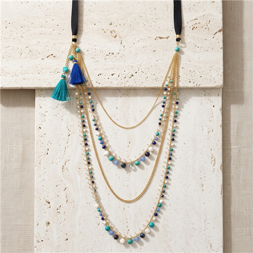 Nakamol multilayer gold tone statement necklace with cascading chains, turquoise, blue and green agate and glass beads, leather details and colorful tassel accents.
