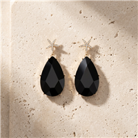 Amrita Singh Hamptons gold tone drop earrings with crystal embellished starfish tops and large faceted black resin teardrop pendants.