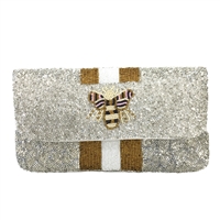 Fashion Culture silver and white beaded clutch featuring a queen bee motif, metallic gold stripe accents, snap flap closure, lined interior, and removable chain crossbody strap.
