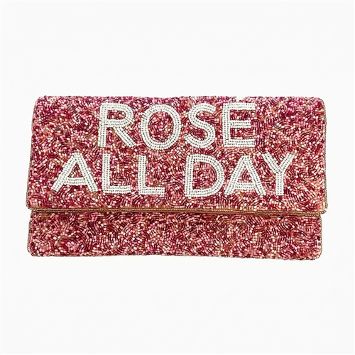Fashion Culture Rose All Day fold over clutch featuring pink hand beaded construction, white statement lettering, fold over design, fabric lined interior, and detachable chain crossbody strap.