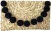 Fashion Culture woven straw envelope clutch in natural straw featuring oversized black pom pom trim, fold over flap closure, lightweight summer design, and a 10 x 6.5 inch silhouette ideal for beach vacations, resort wear, and warm weather occasions.