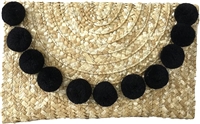 Fashion Culture woven straw envelope clutch in natural straw featuring oversized black pom pom trim, fold over flap closure, lightweight summer design, and a 10 x 6.5 inch silhouette ideal for beach vacations, resort wear, and warm weather occasions.