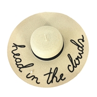 Fashion Culture natural paper straw floppy wide brim sun hat featuring Head In The Clouds sequin lettering, faux pearl accent, black grosgrain ribbon band, and adjustable inner band for beach vacations, resort wear, and summer sun protection.