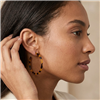 The Bagtique Jewelry Collection Jazlyn  2 inch tortoise shell effect hoop earrings with a slim round silhouette and mottled amber, honey brown, and black pattern.