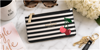 Kate Spade Bing Cherries slim card holder wallet in navy and cream striped saffiano PVC featuring cherry appliquÃ© details, seven card slots, zip coin compartment, and signature logo hardware.