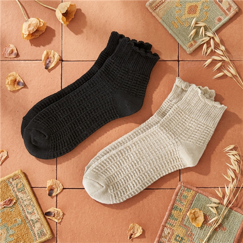 Lucky Brand textured quarter socks for women with scalloped ruffle cuffs, shown in black and light neutral color options.