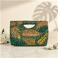 BTC  tropical leaf beaded clutch featuring hand-applied green, teal, olive, and gold beadwork with sequined palm and monstera leaf motifs, cutout handle, removable chain strap, and convertible clutch-to-crossbody styling.