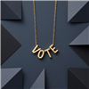 Zad Jewelry gold tone VOTE letter necklace with four dimensional letter charms on a delicate adjustable link chain.