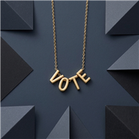 Zad Jewelry gold tone VOTE letter necklace with four dimensional letter charms on a delicate adjustable link chain.