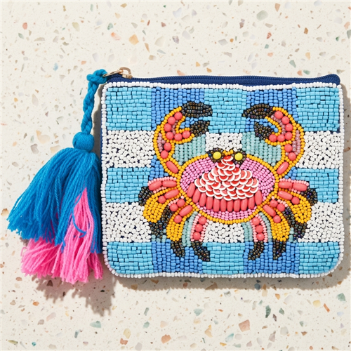 Bamboo Trading Company beaded zip pouch featuring a colorful pink, coral, yellow, and black crab on blue and white stripes with oversized blue and pink tassels.