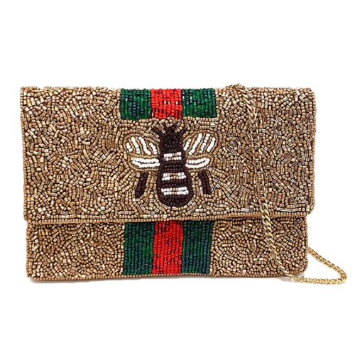 Gold multi mini clutch crossbody bag with a beaded front, dimensional black and white bee motif, green and red vertical stripes, foldover silhouette, and removable gold tone chain strap.