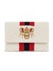 Ivory beaded foldover clutch crossbody bag with a dimensional gold tone bee motif, red and black vertical racing stripes, textured beadwork, and removable chain strap.