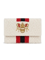 Ivory beaded foldover clutch crossbody bag with a dimensional gold tone bee motif, red and black vertical racing stripes, textured beadwork, and removable chain strap.