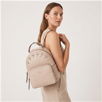 Warm beige Kate Spade mini leather backpack featuring pebbled genuine leather construction, metallic stud embellishments, structured top handle, front zip pocket, and compact designer silhouette for everyday fashion styling